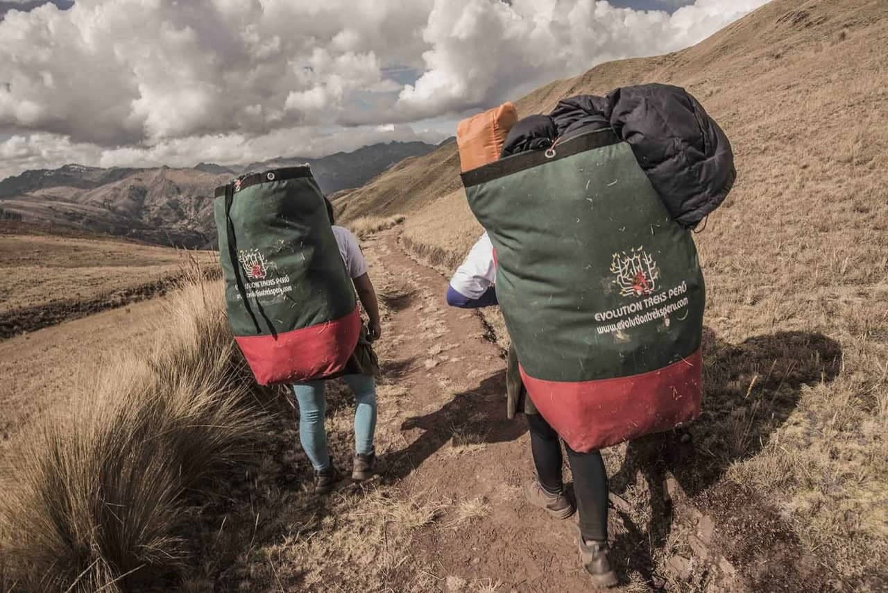 Female Inca Trail porters with packs